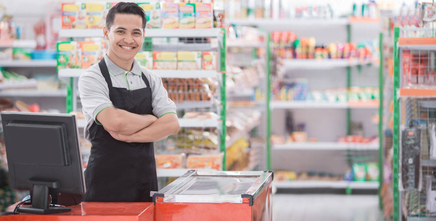 stock photo portrait of a smiling shopkeeper in a grocery store 753589228